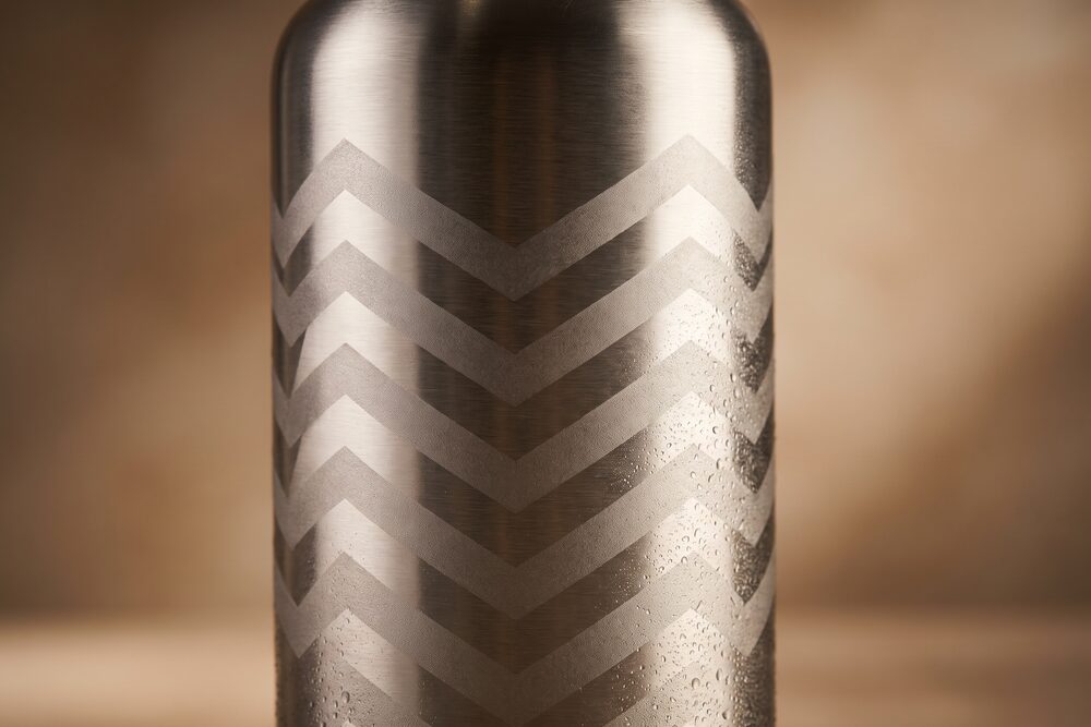 Frosted chevrons deep-etched into a brushed stainless bottle